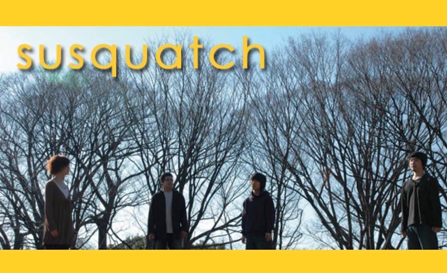 The four members of susquatch standing beneath bare trees