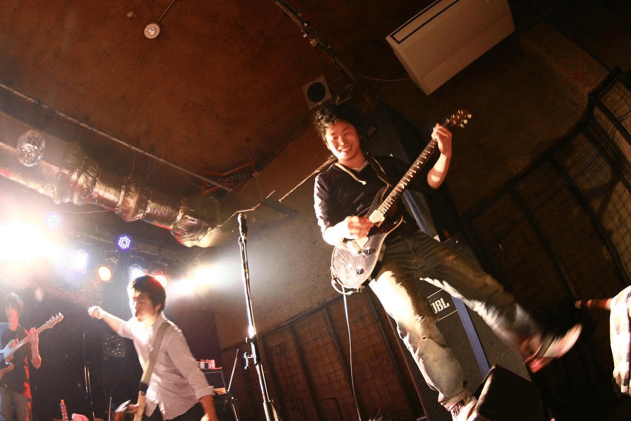 Susquatch guitarist jumping during a live performance